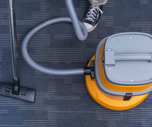 Anonymous,Top,View,Shot,Of,A,Vacuum,Cleaner,With,A