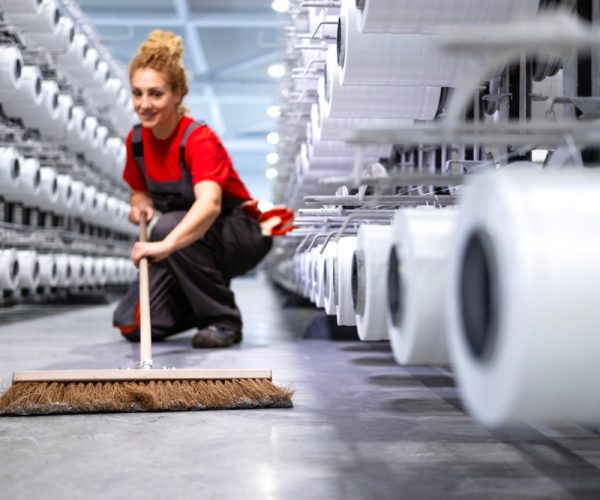 Female,Worker,Cleaning,Floor,With,Broom.,Keeping,Factory,Neat,And