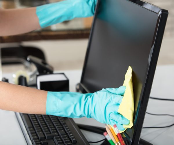 Close-up,Of,A,Woman's,Hand,Cleaning,The,Desktop,Screen,With