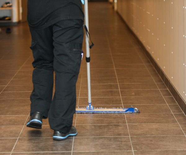 A,Woman,Is,Cleaning,The,Floors,In,A,School,Corridor.